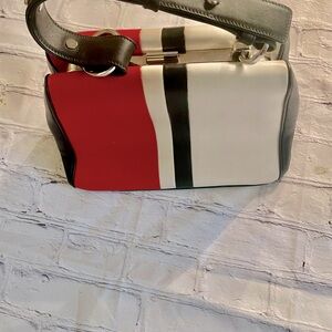 - Gorgeous Prada vintage white, red and black bag. 
Silver PRADA logo on s…